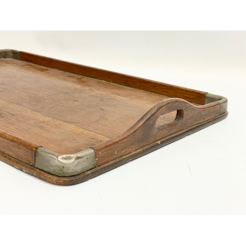 637 - An Edwardian oak and silver plated serving tray. 44x28cm.