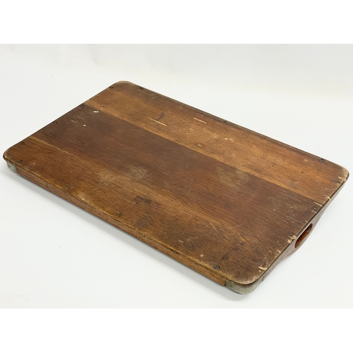 637 - An Edwardian oak and silver plated serving tray. 44x28cm.