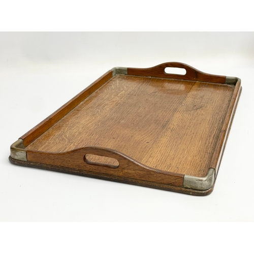 637 - An Edwardian oak and silver plated serving tray. 44x28cm.