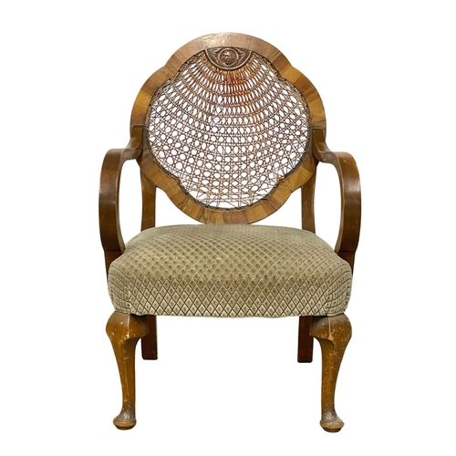 238 - A 1930’s bergere back armchair.