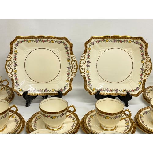 639 - A vintage 38 piece Tuscan China ‘Plant’ pattern tea set.