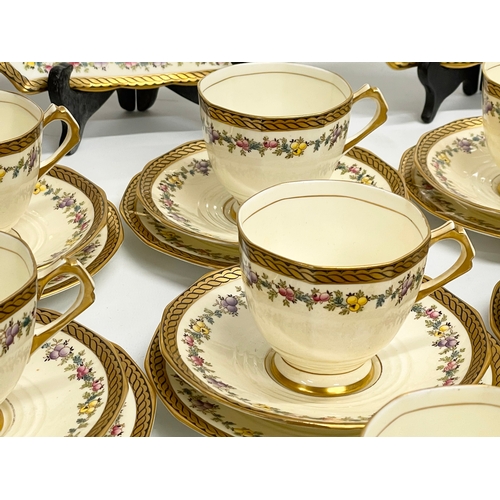 639 - A vintage 38 piece Tuscan China ‘Plant’ pattern tea set.