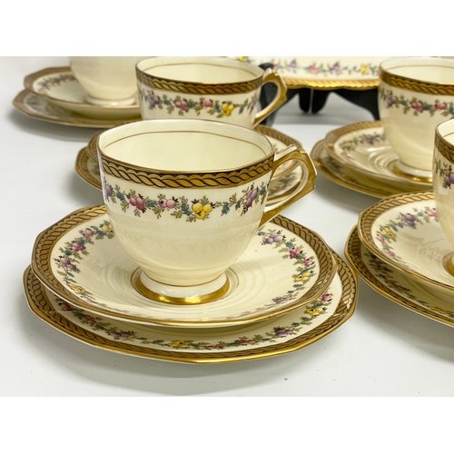 639 - A vintage 38 piece Tuscan China ‘Plant’ pattern tea set.