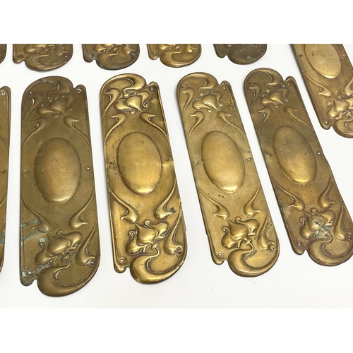 94 - A set of 13 late 19th century Art Nouveau brass finger plates. 7.5x29cm