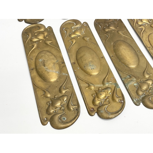 94 - A set of 13 late 19th century Art Nouveau brass finger plates. 7.5x29cm