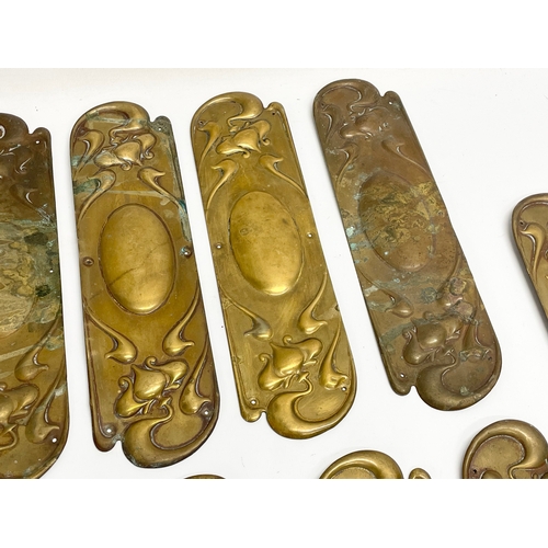 94 - A set of 13 late 19th century Art Nouveau brass finger plates. 7.5x29cm