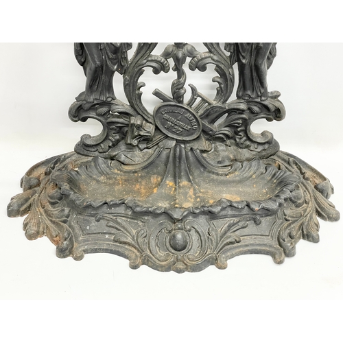 95 - A large vintage ornate cast iron umbrella stick stand. 76x31x80cm.