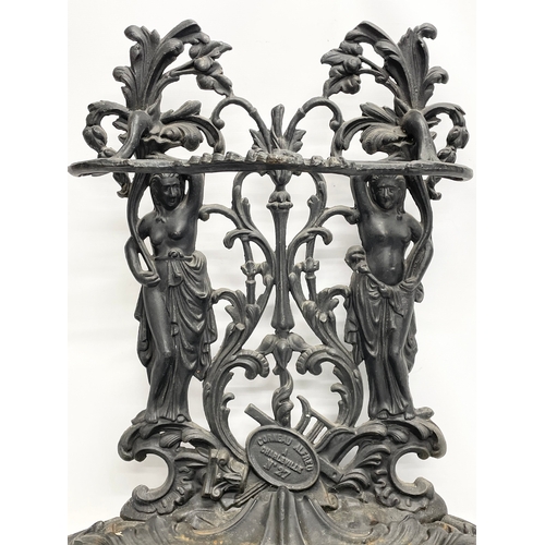 95 - A large vintage ornate cast iron umbrella stick stand. 76x31x80cm.