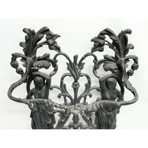 95 - A large vintage ornate cast iron umbrella stick stand. 76x31x80cm.