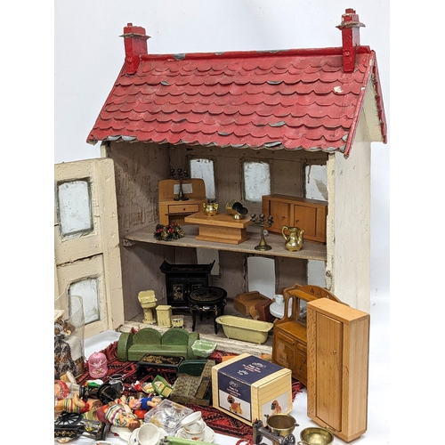 572 - A vintage doll's House with accessories. House measures 47x25x57cm