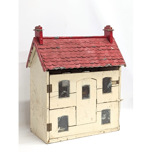 572 - A vintage doll's House with accessories. House measures 47x25x57cm