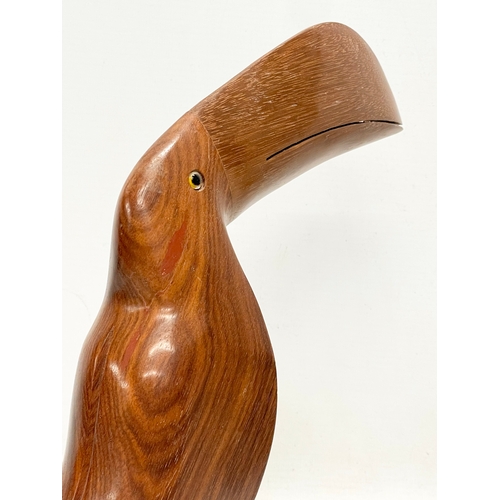 643 - A Mid Century Brazilian rosewood Toucan with glass eyes. 30x28cm