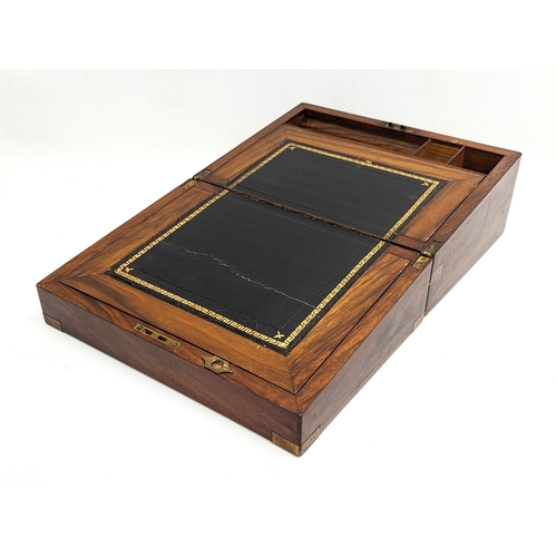 348 - A Victorian mahogany brass bound writing slope. 30.5x22.5x15cm