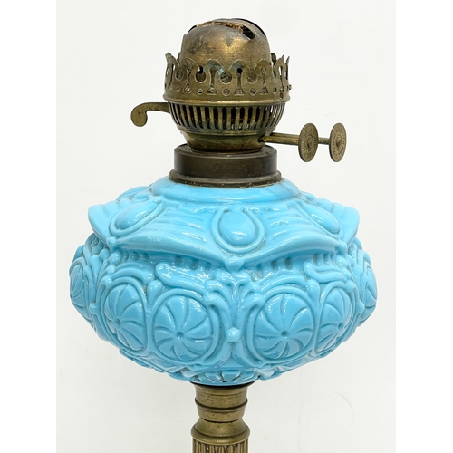 353 - A Victorian oil lamp. 43cm.