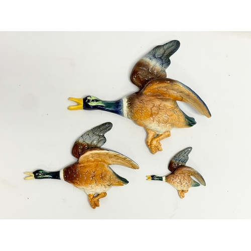 680 - A set of 3 vintage pottery birds by Falcon Ware. Largest measures 31x25cm