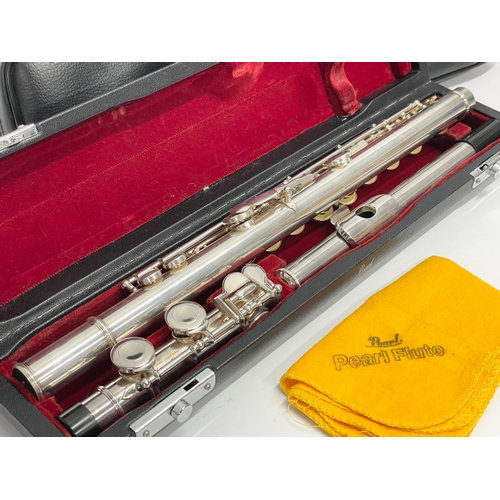 574 - A flute in case by Pearl. Case measures 41cm.