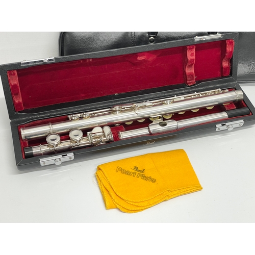 574 - A flute in case by Pearl. Case measures 41cm.