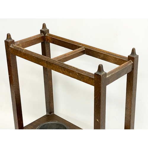 246 - A 1920’s oak stick stand. 51x23x61cm.