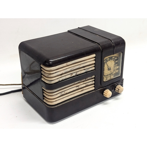 580 - A vintage Bakelite radio with a transformer. Radio measures 20x14cm