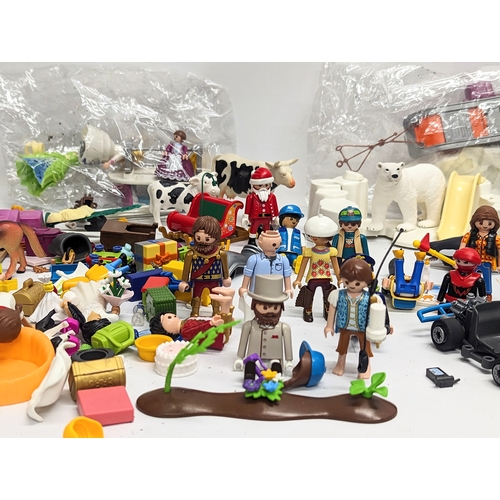 581 - A quantity of Playmobil toy figures and accessories, etc.