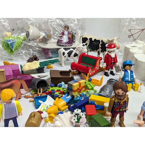 581 - A quantity of Playmobil toy figures and accessories, etc.