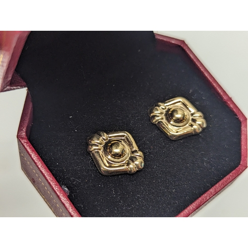 786 - A pair of 9ct gold earrings.