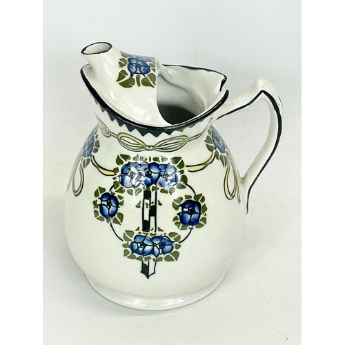 684 - A Frederick Rhead Wood & Sons LTD teapot. 13x16cm