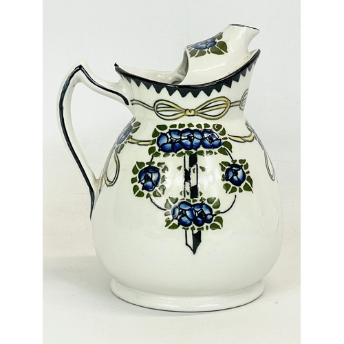 684 - A Frederick Rhead Wood & Sons LTD teapot. 13x16cm