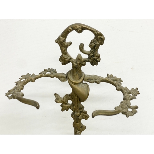 501 - A vintage ornate brass umbrella stick stand. 32x56cm