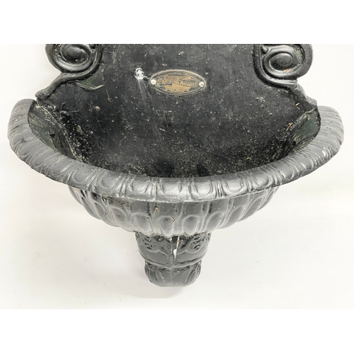 504 - A Victorian style cast alloy garden wall mounted font. 46x73cm