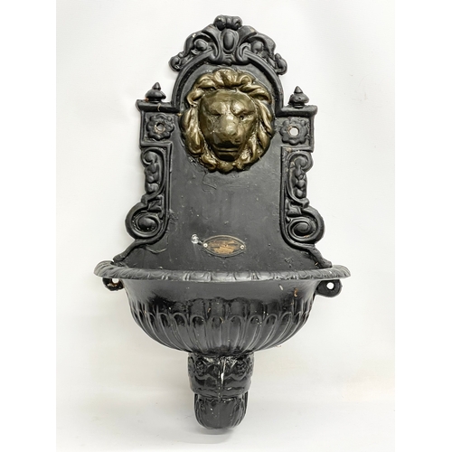 504 - A Victorian style cast alloy garden wall mounted font. 46x73cm