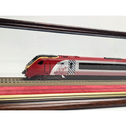 585H - A large model train in case, presented to Dave Wright in recognition of 42 years service to the rail... 