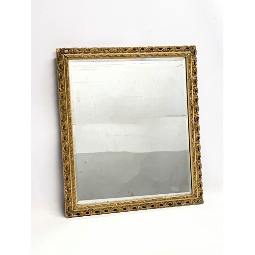 503 - A vintage ornate gilt framed bevelled mirror. 46.5x51.5cm