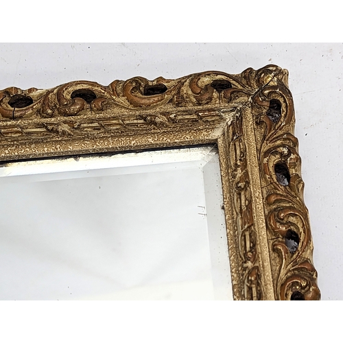 503 - A vintage ornate gilt framed bevelled mirror. 46.5x51.5cm