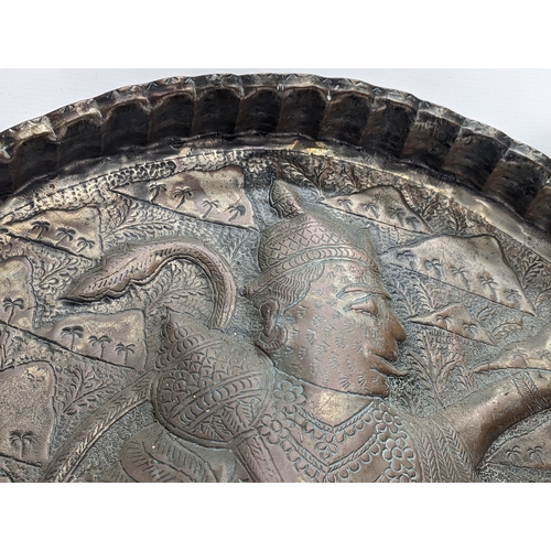 689 - A large late 19th century Indian copper wall plaque / tray. 64.5cm