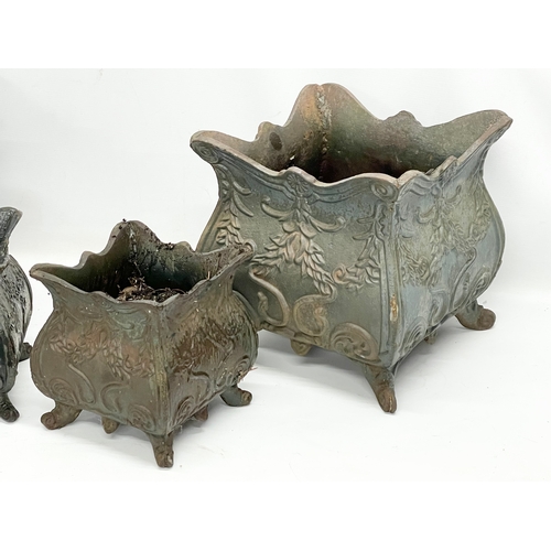 177 - A set of 4 vintage late Regency style cast iron garden planters. Largest pair measures 31x31x31cm