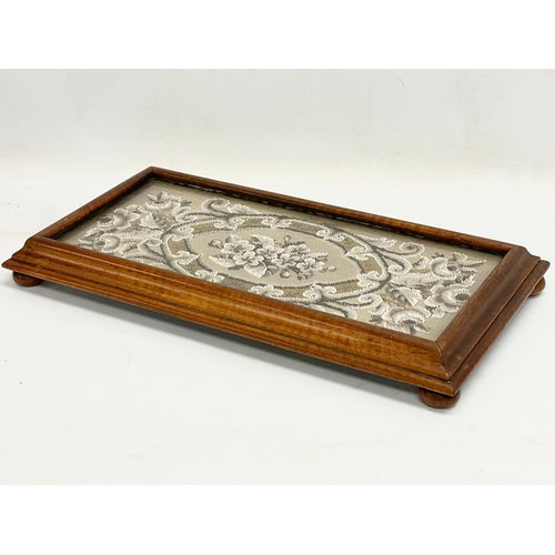 694 - A Victorian mahogany framed stand with beadwork and glass top. 50x26x6cm