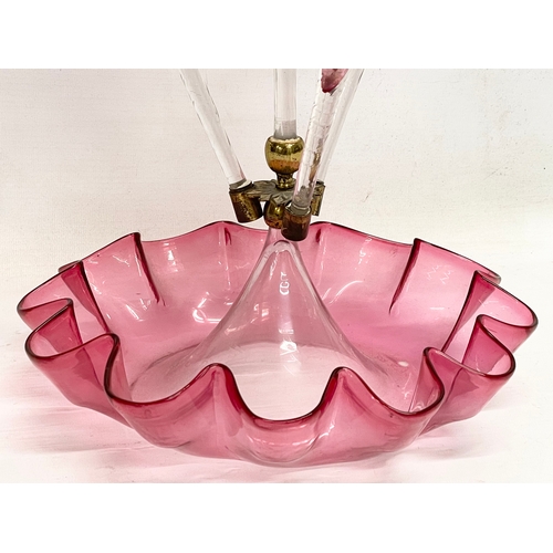 695 - A large Victorian Cranberry Glass epergne. 29x51cm