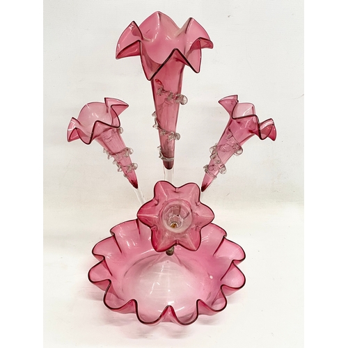 695 - A large Victorian Cranberry Glass epergne. 29x51cm