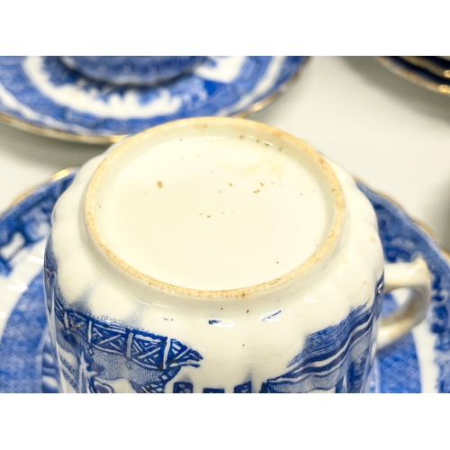 701 - A 35 piece late 19th century Paragon Willow Pattern porcelain tea set.