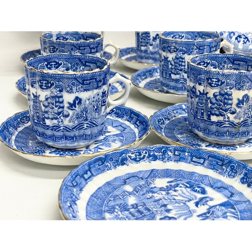 701 - A 35 piece late 19th century Paragon Willow Pattern porcelain tea set.