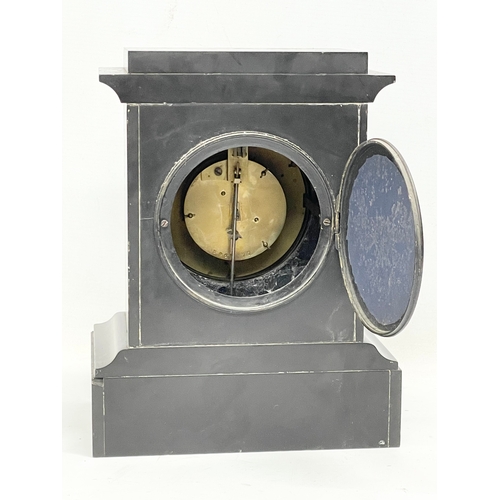 702 - A Victorian slate mantle clock. With pendulum. 22x15x28.5cm