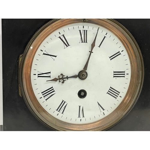 702 - A Victorian slate mantle clock. With pendulum. 22x15x28.5cm