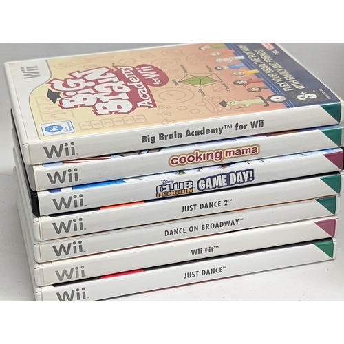 585R - A Nintendo Wii game console with leads and controllers, including games, Cooking Mama, Just Dance, e... 