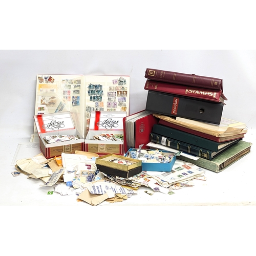 792 - A large collection of international stamps and stamp albums, etc.