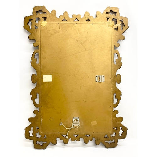 521N - A vintage ornate gilt framed mirror. 61x84cm