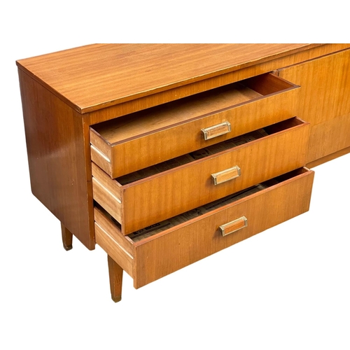 124 - A Mid Century teak sideboard. 185.5x39x74cm