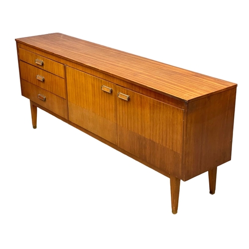 124 - A Mid Century teak sideboard. 185.5x39x74cm