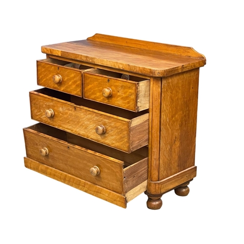 242 - A Victorian Satin Birch gallery back chest of drawers on bun feet. 106x45x95cm.