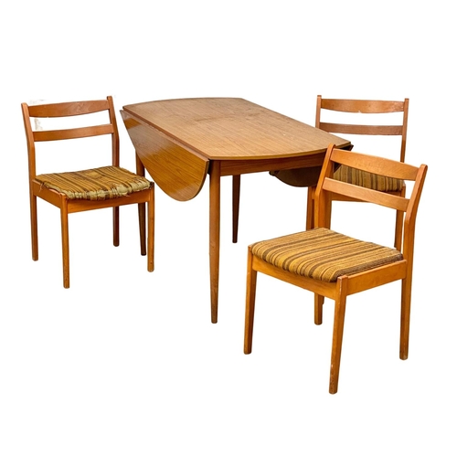 249 - A Mid Century drop leaf dining table and 3 chairs, by Schreiber